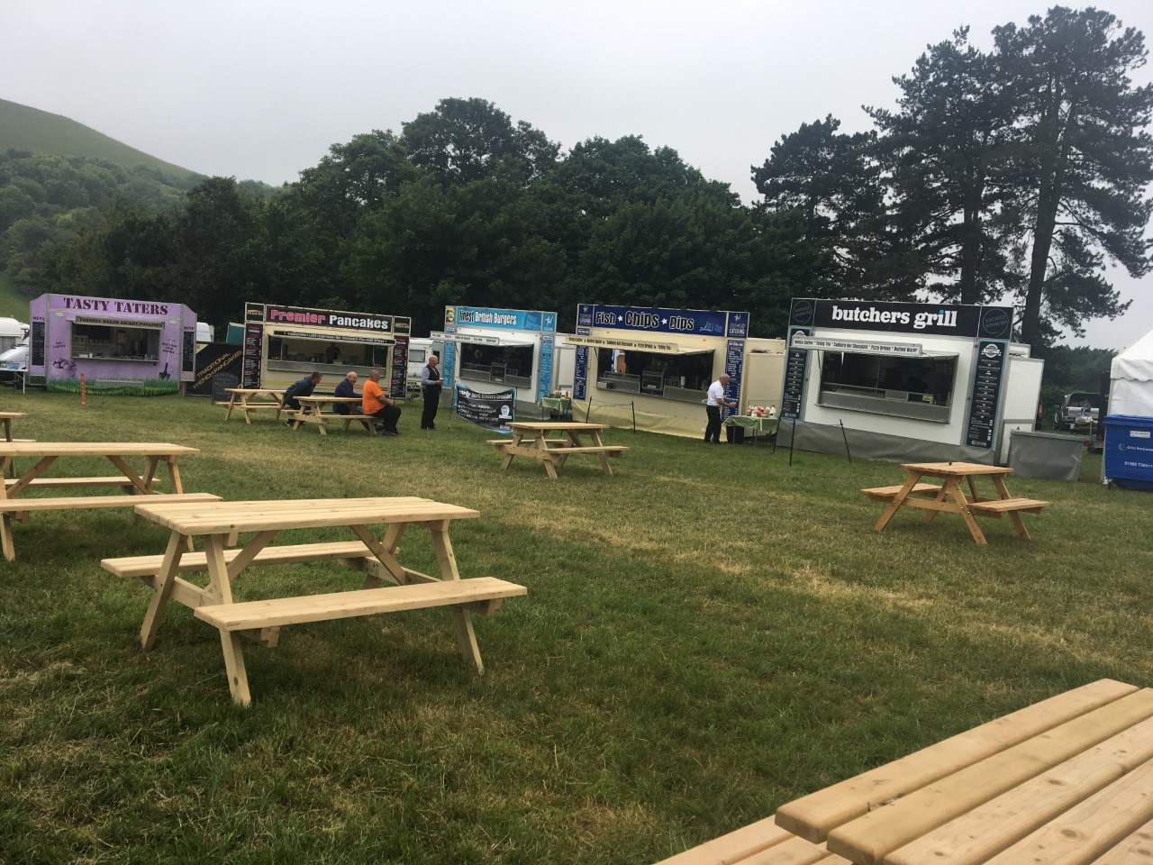 Potato, pancakes, gourmet burger, fish and chips catering event vans arranged to make a food court